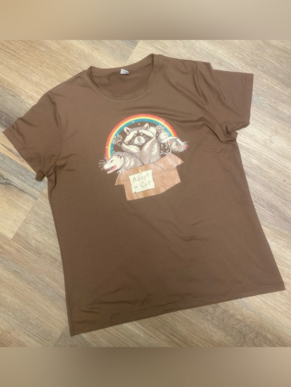 Women’s Brown Graphic Tee with Rainbow Raccoon Design “adopt a cat” XL